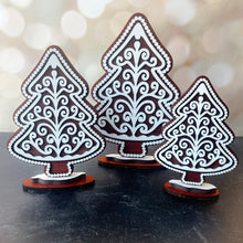 Load image into Gallery viewer, Three decorative wooden trees with intricate white patterns on a dark surface.