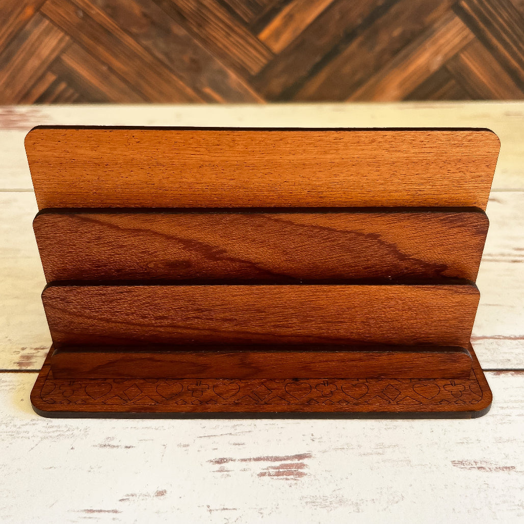 Wooden display stand with three tiers on a wooden surface