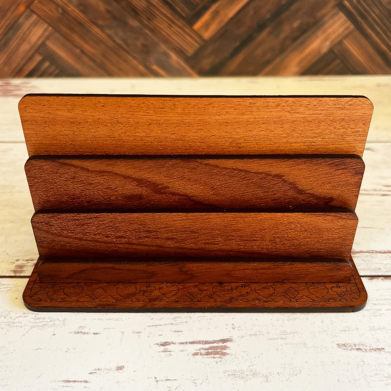 Wooden display stand with three tiers on a wooden surface