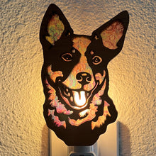 Load image into Gallery viewer, A laser-cut wooden night light in the shape of a dog&#39;s head, glowing with a warm light.