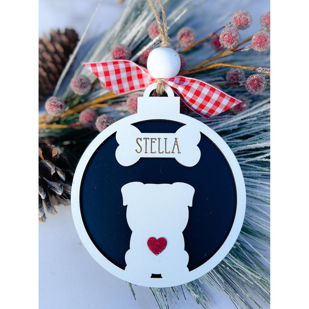 A personalized dog silhouette ornament with a white and black color scheme, adorned with a red and white checkered ribbon and a small red heart.