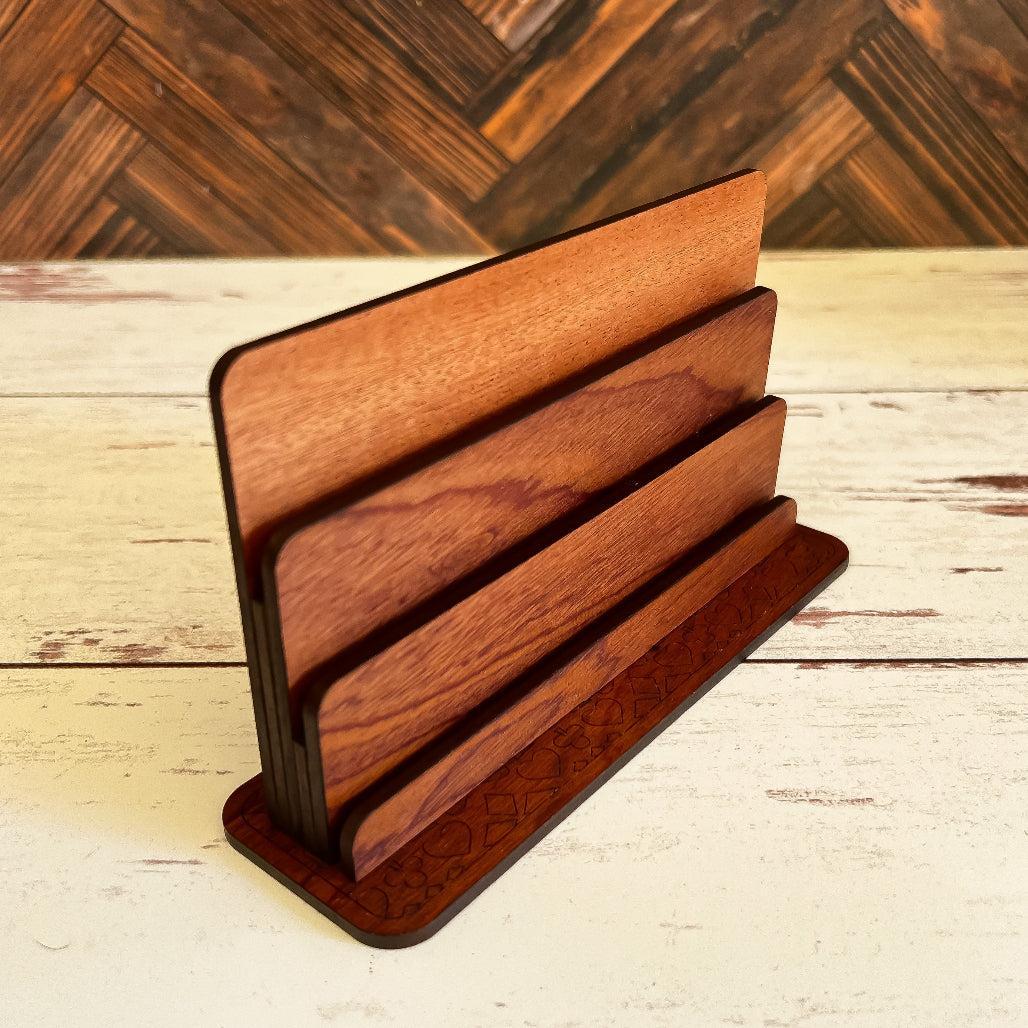 Playing card holder on a wooden surface with a wooden wall background