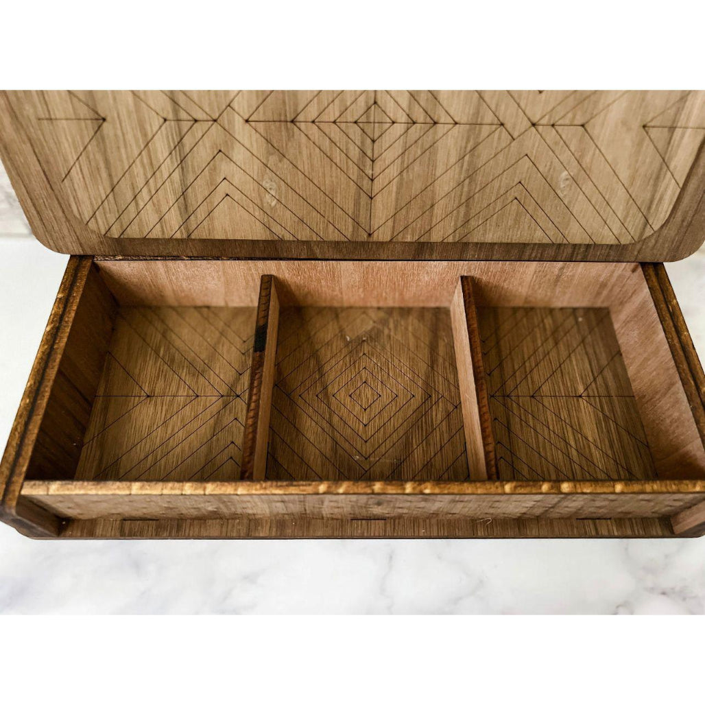 Inside of cribbage board with three slots for storage