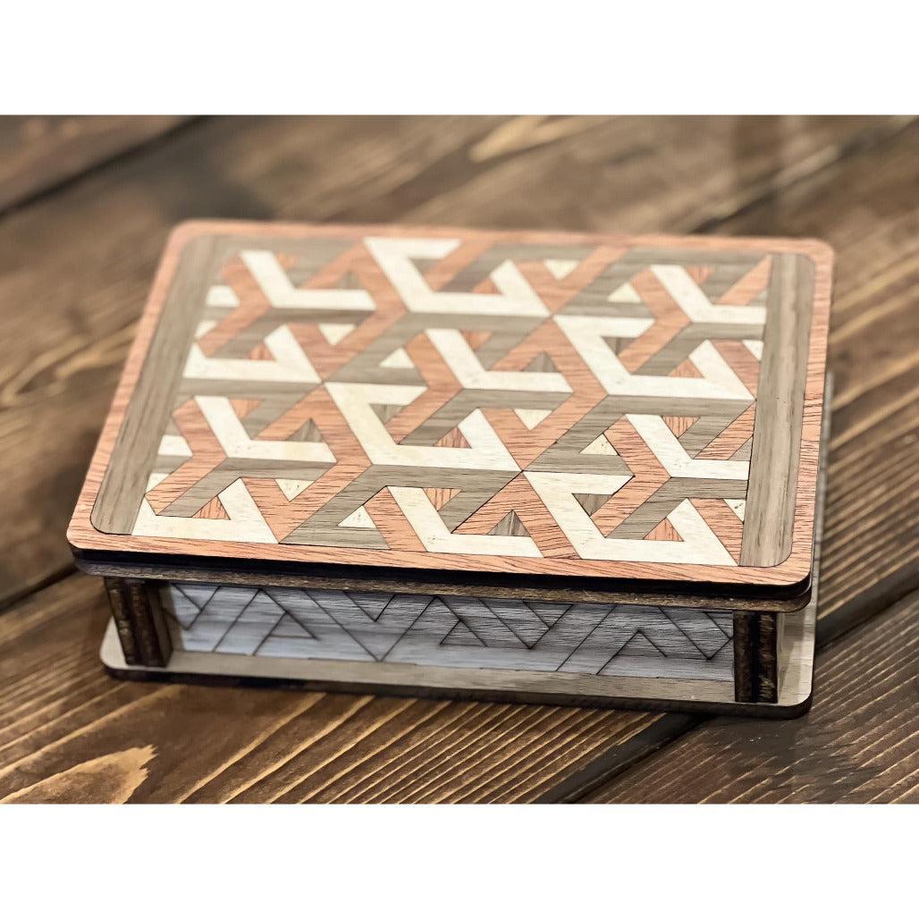 A wooden box with a geometric pattern on the lid