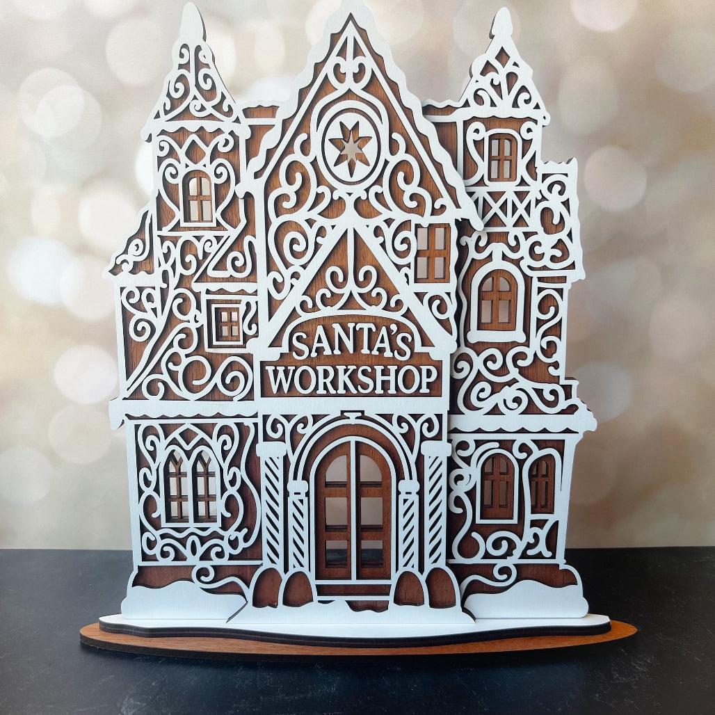 Decorative model of Santa's Workshop with intricate details on a blurred background