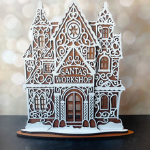 Load image into Gallery viewer, Decorative model of Santa&#39;s Workshop with intricate details on a blurred background