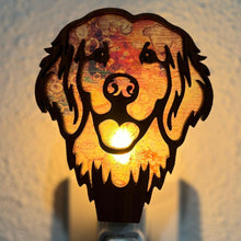 Load image into Gallery viewer, A laser-cut wooden night light in the shape of a dog&#39;s head, glowing with a warm light.