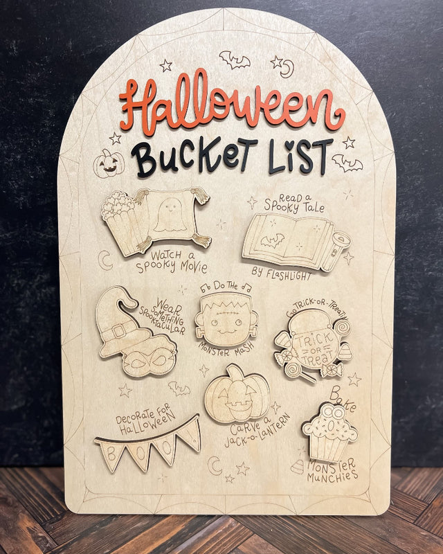 Halloween-themed bucket list board with illustrations on a dark background