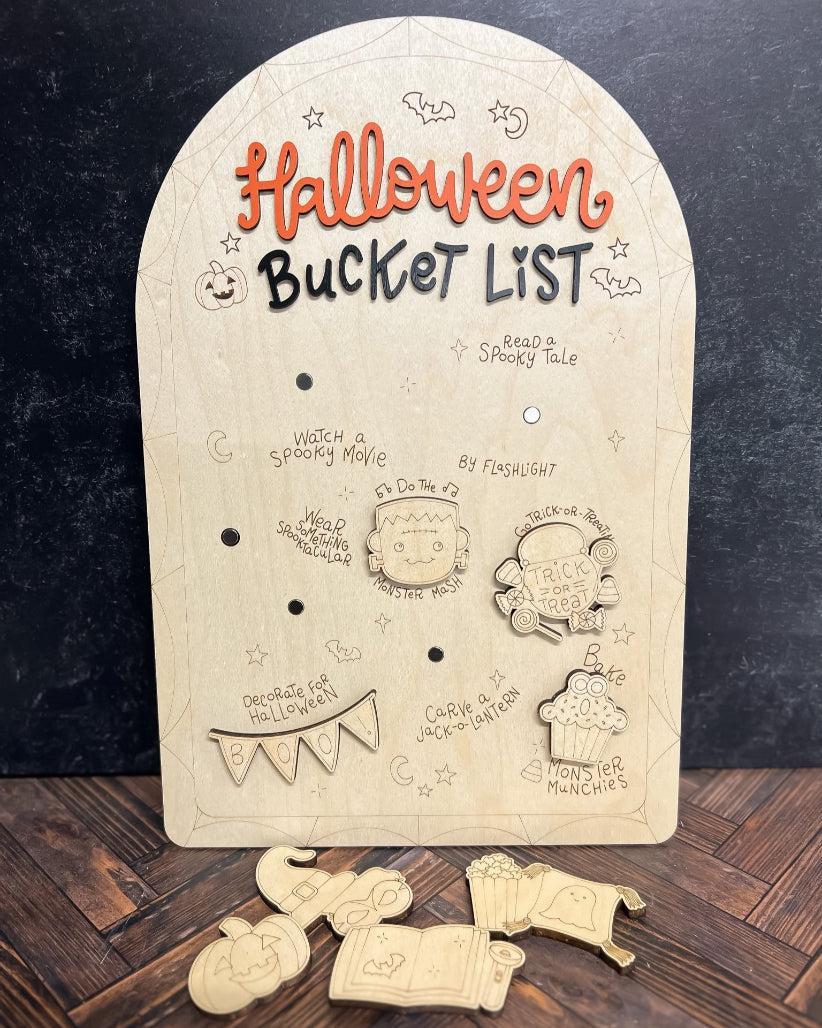 Wooden Halloween-themed board with cut-out pieces on a dark background