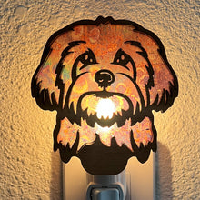 Load image into Gallery viewer, A laser-cut wooden night light in the shape of a dog&#39;s head, glowing with a warm light.