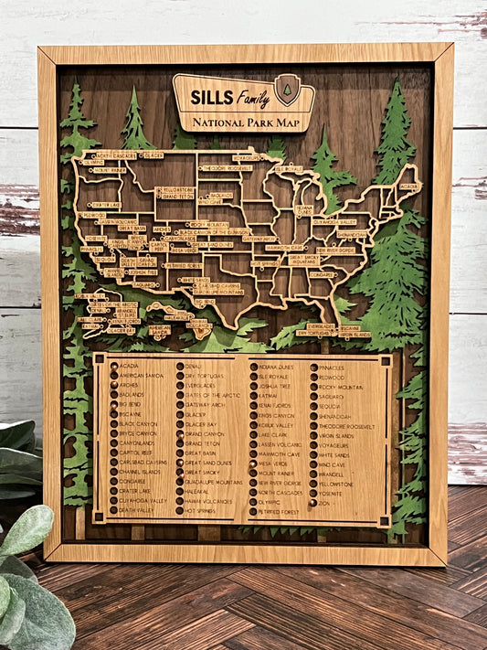 A wooden National Park Tracker Map with a list of national parks, featuring laser cut designs in the shape of the United States and personalized engravings.