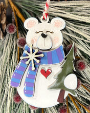 Load image into Gallery viewer, Decorative white bear ornament with a striped scarf holding a tree.