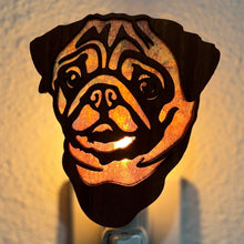 Load image into Gallery viewer, A laser-cut wooden night light in the shape of a dog&#39;s head, glowing with a warm light.