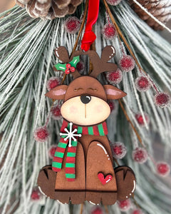 Christmas reindeer ornament with a scarf on a decorative background