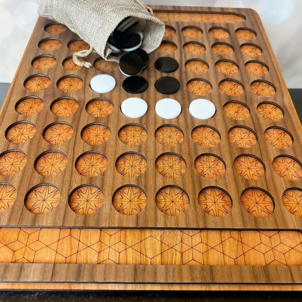 Wooden game board with circular compartments and game pieces on a marble surface