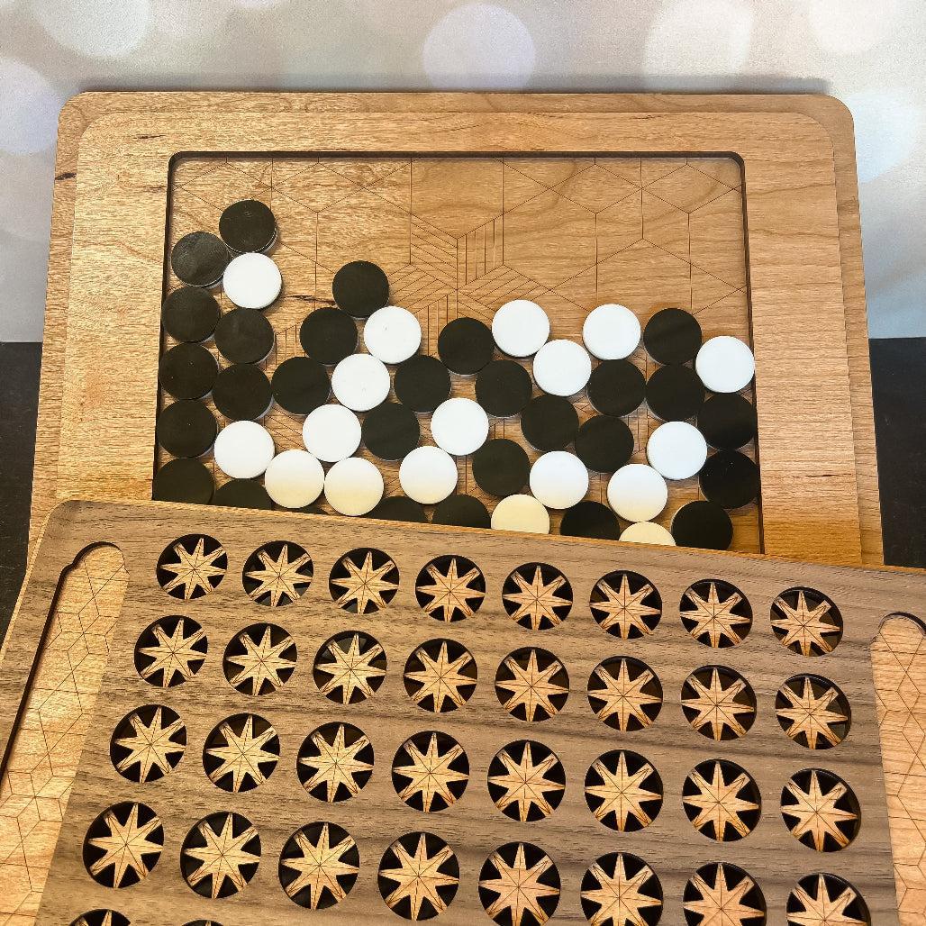 Wooden puzzle with circular and star-shaped pieces on a wooden board.