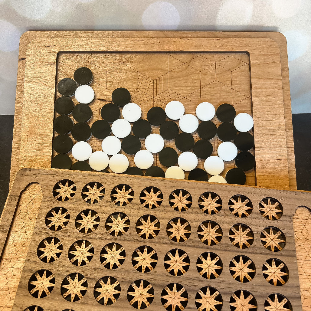 Wooden puzzle with circular and star-shaped pieces on a wooden board.