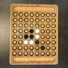 Load image into Gallery viewer, Wooden puzzle board with star patterns and circular cutouts on a dark surface