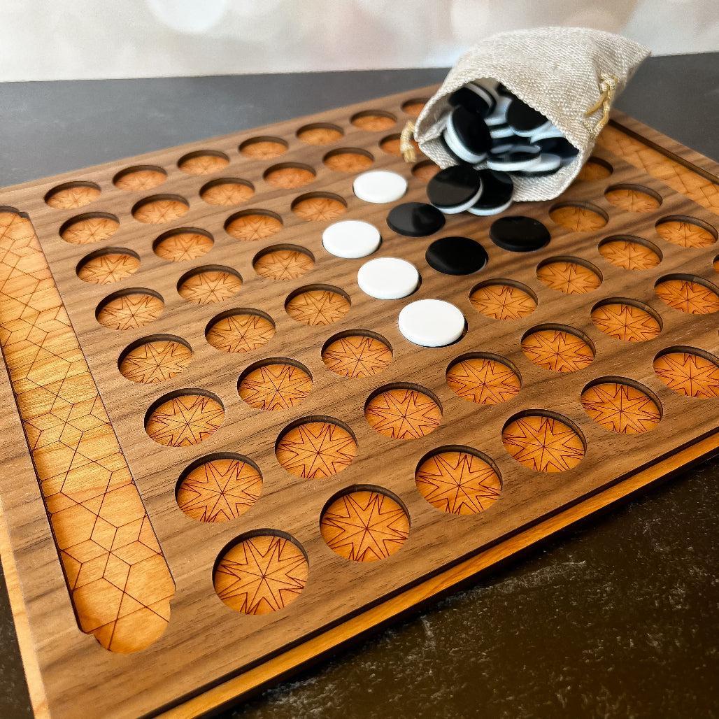 Wooden game board with circular holes and checkers in a bag on a dark surface
