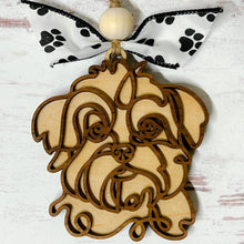 Load image into Gallery viewer, A wooden ornament in the shape of a doodle art depiction of a dog breed, with a paw print ribbon and bead decorations.