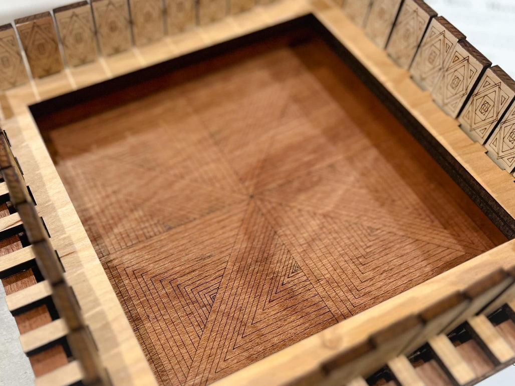 Center detail shown with geometric shapes