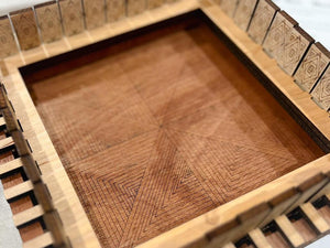 Center detail shown with geometric shapes