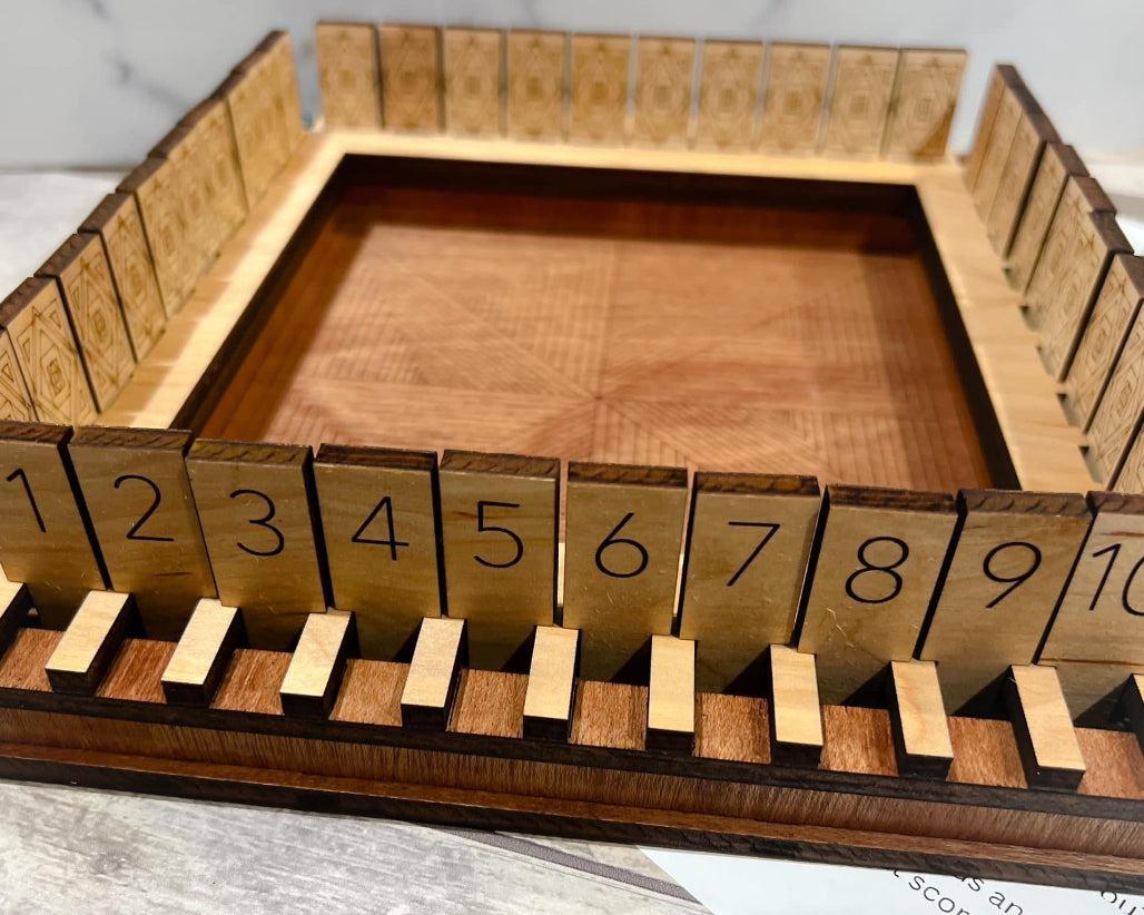 Overview of Shut the Box Game on wood table