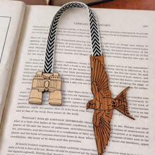 Load image into Gallery viewer, Wooden bookmark with bird and compass design on an open book