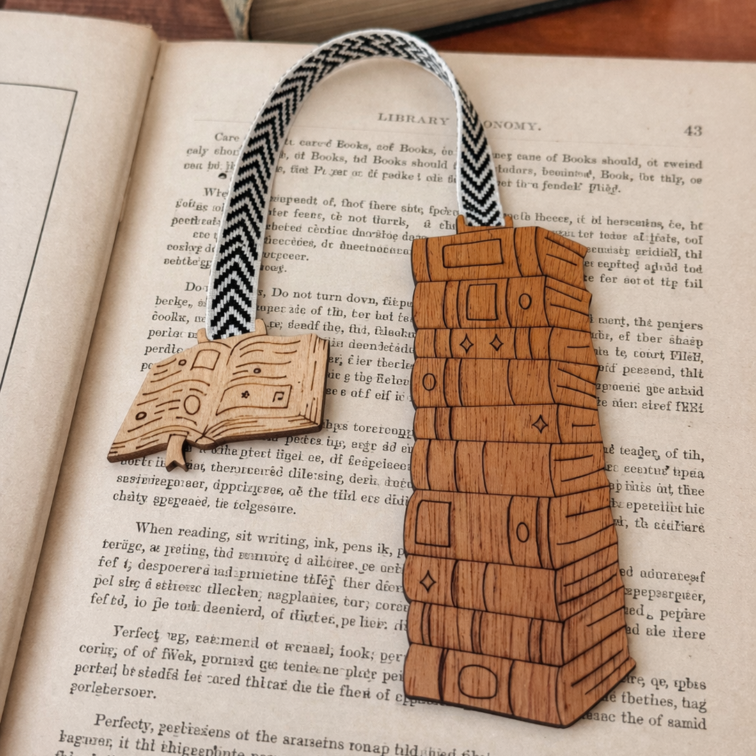 Wooden bookmark shaped like a chest on an open book