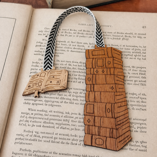Wooden bookmark shaped like a chest on an open book