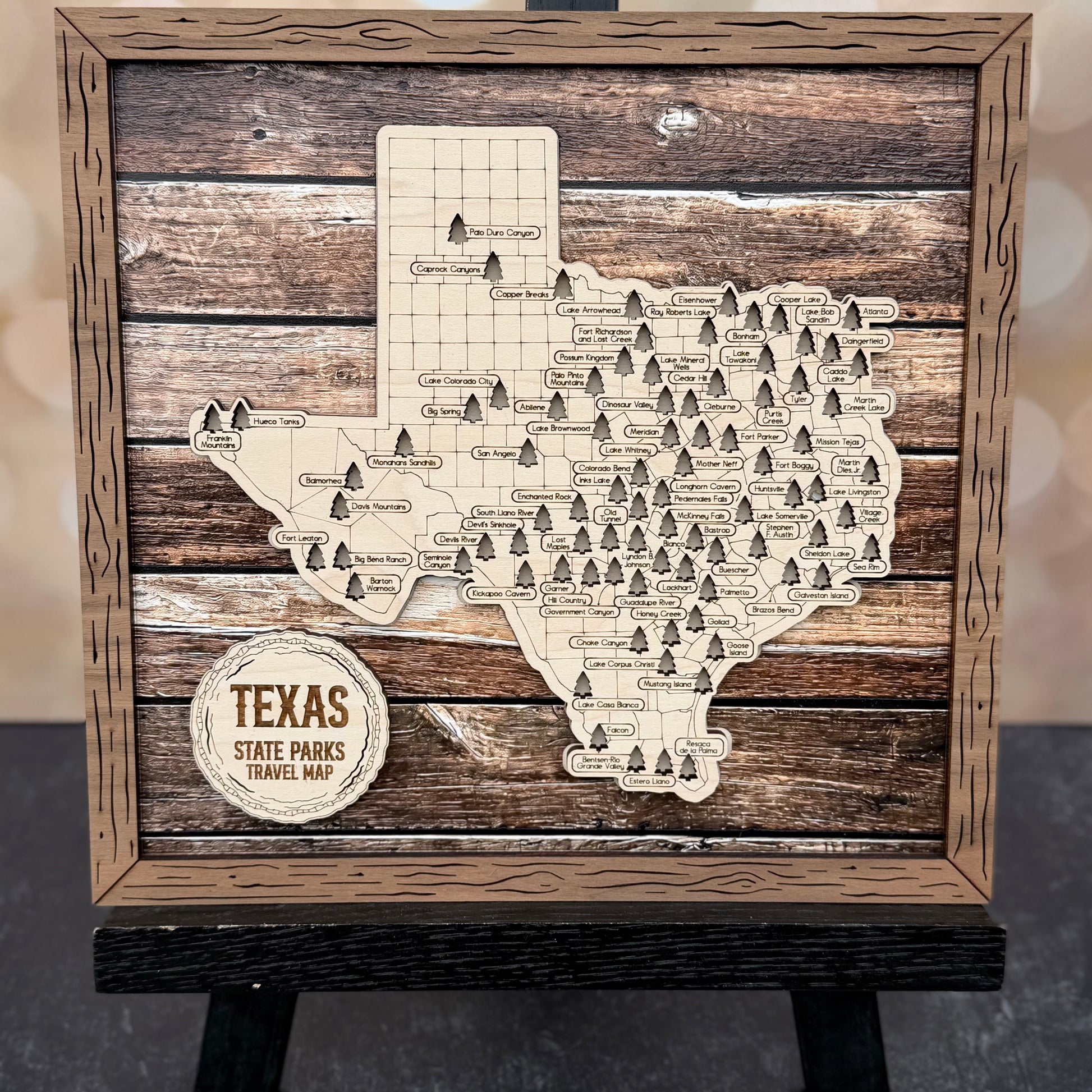 Wooden map of Texas with state parks on a wooden stand against a wood background